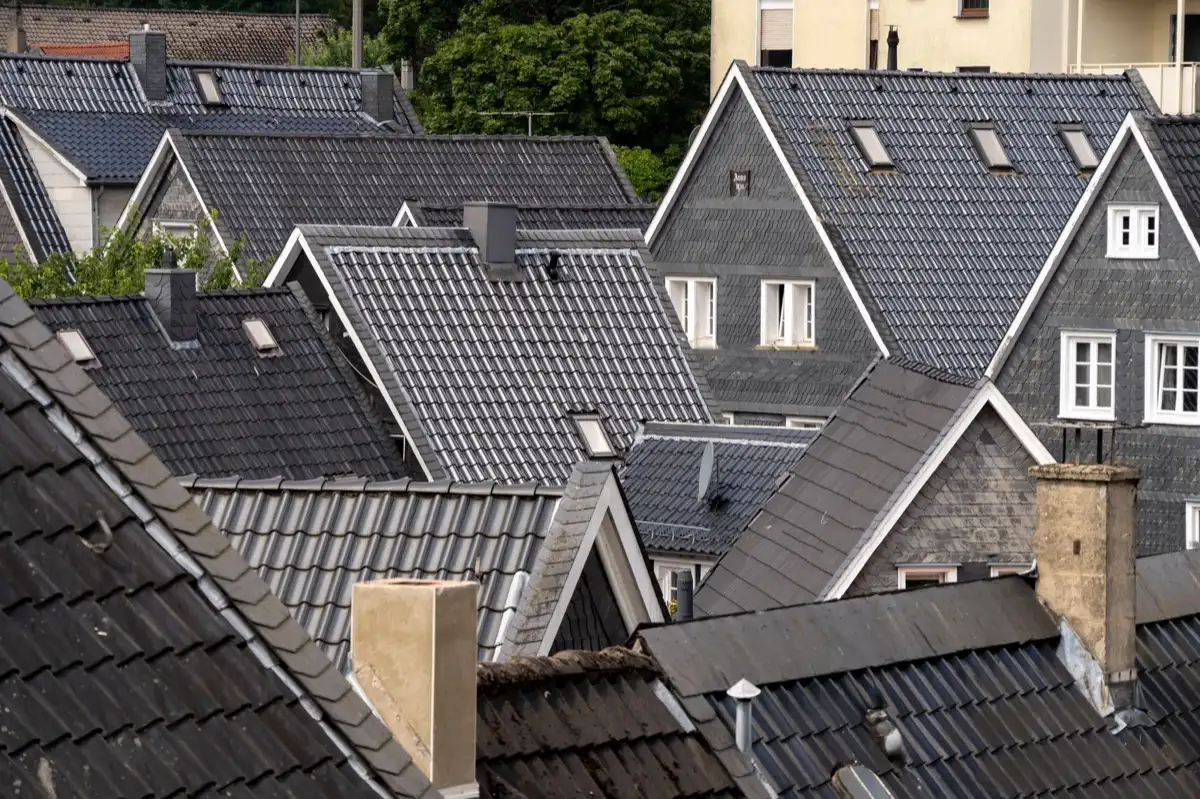 Steep roof eaves and gutter lines on houses in Laredo, TX
